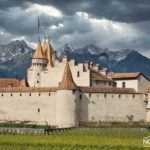 aigle castle on the background of the alps