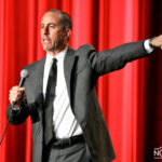 jerry seinfeld perform on stage in los angeles gala