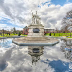 statue of queen victoria reflected in water at Kensington Gardens, London