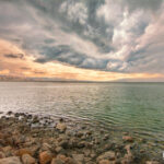 dramatic sunset with storm clouds above the Sea of Galilee in Israel