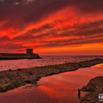 Sunset at the Port of Tel Aviv with man standing on pier