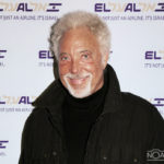singer tom jones at the airport boarding a plane