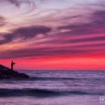 fisherman finishing at sunset in the sea