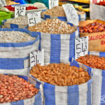 bags of nuts and fruits at a market